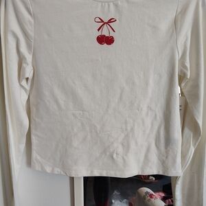No Boundaries Cream Long Sleeve Top with Red Cherry Accent